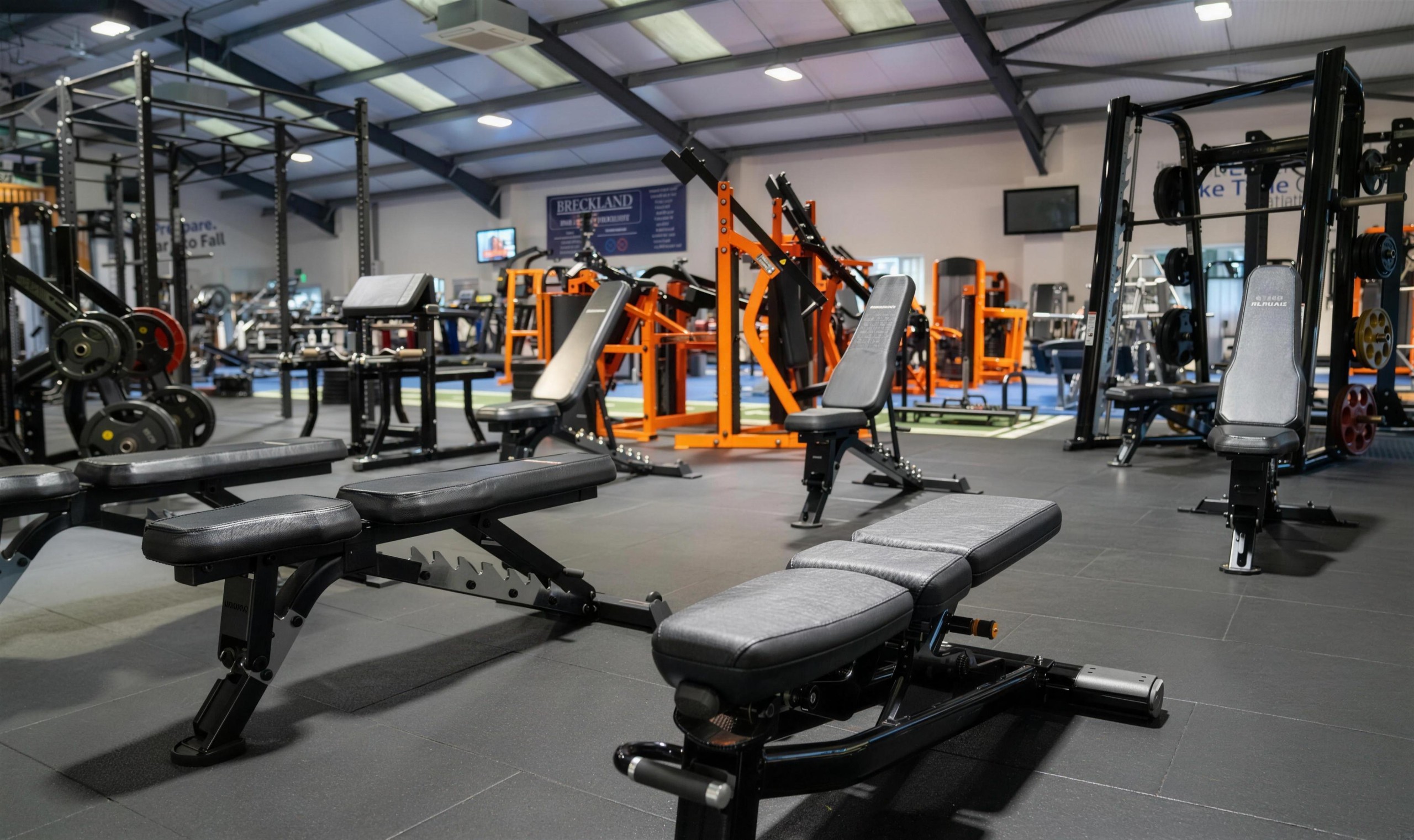 Benches and free weights at Amazon Gym