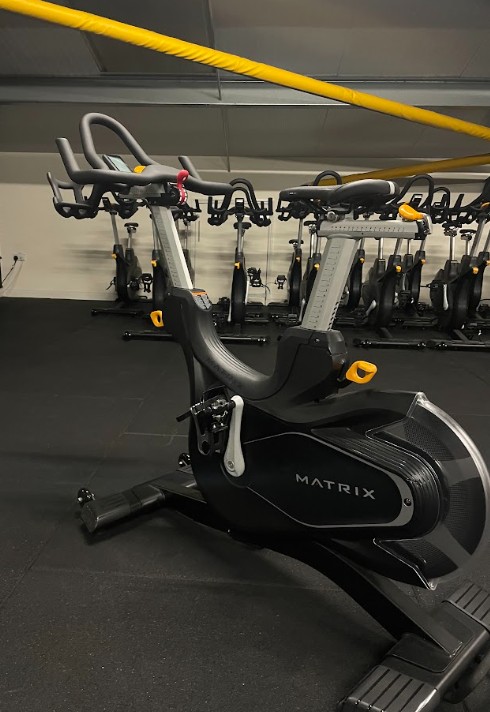 The row of spin bikes